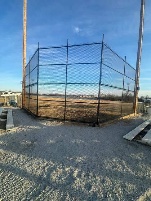 Chain link backstop fencing at a ballfield