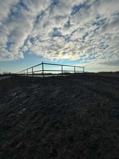 Pipe fence line at dusk